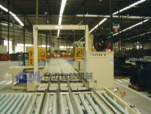 Motorcycle engine board arrangement, strapping and conveyor line